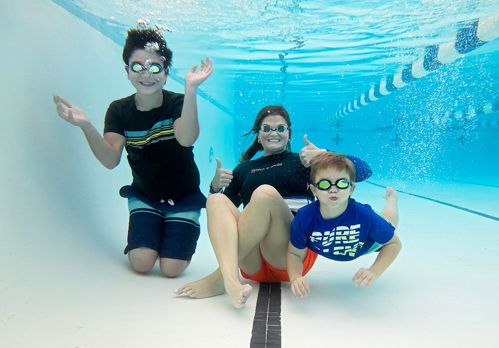 Beckwith Hastings and children underwater