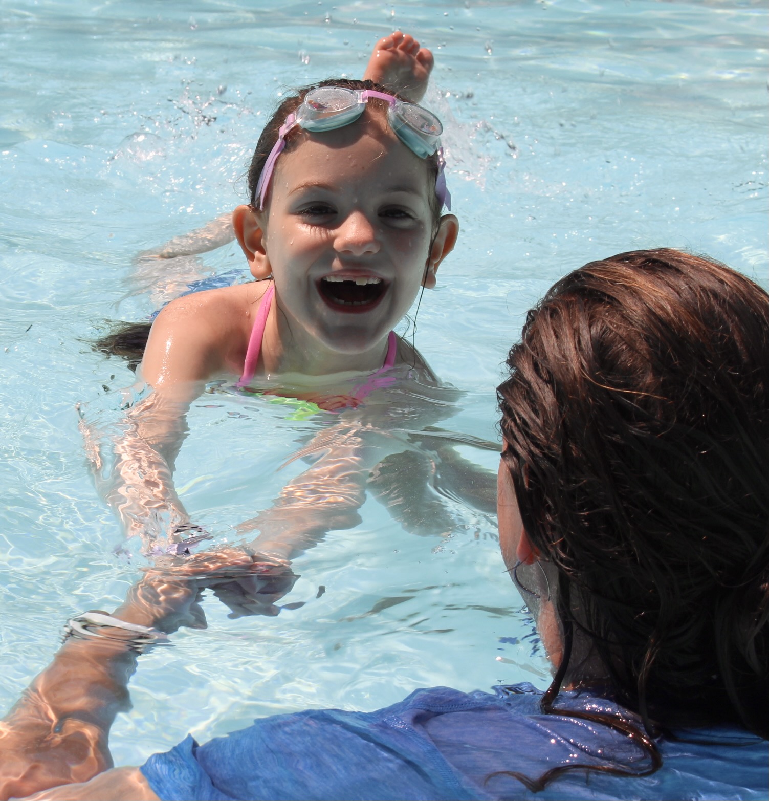 child learning to swim